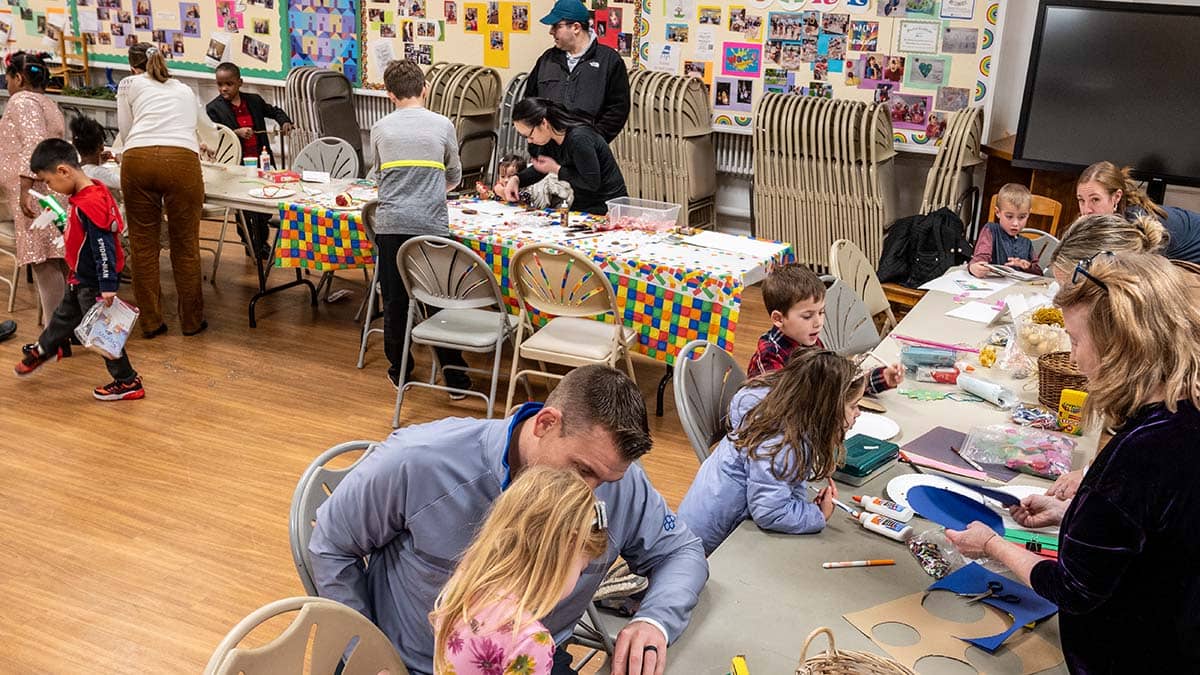 Children and families at Crafts Tables, Holiday Book Fair 2023