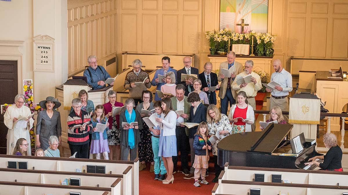 Congregants assemble on the Chancel steps to sing Handel's Hallelujah Chorus at the conclusion of East Church's 2024 Easter Sunday service