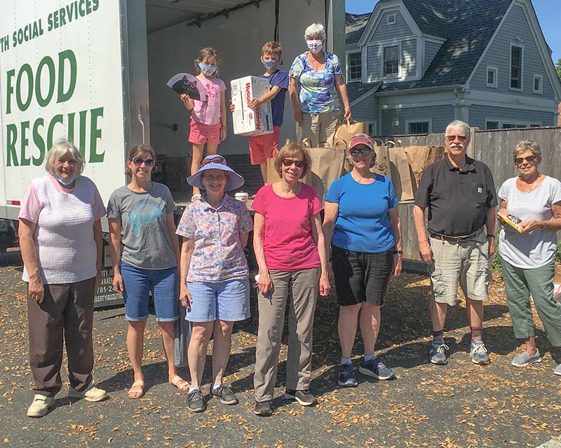Food Drive volunteers in front of ISS collection truck