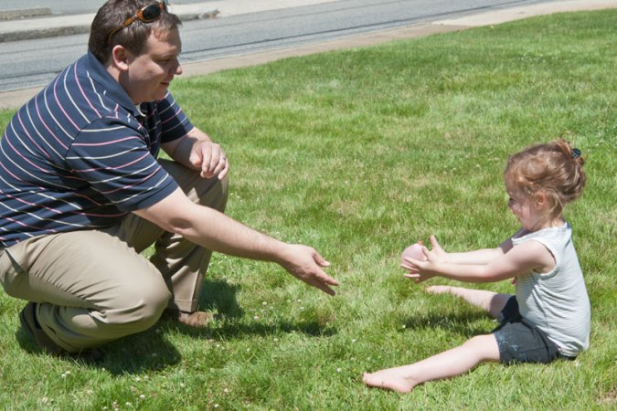 Cautious water balloon toss.