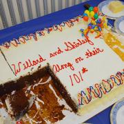 no one told the photographer about the cake until it was half gone!