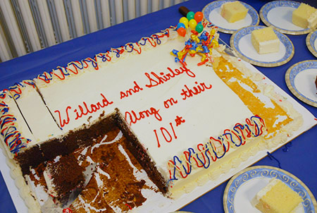 no one told the photographer about the cake until it was half gone!