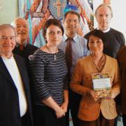 Milton Interfaith Clergy Association  presented Dianne Arakawa with a book. It is Thomas Friedman's Hot, Flat and Crowded: Why We Need a Green Revolution-- and How It Can Renew America