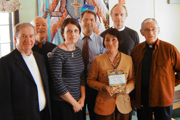 Milton Interfaith Clergy Association  presented Dianne Arakawa with a book. It is Thomas Friedman's Hot, Flat and Crowded: Why We Need a Green Revolution-- and How It Can Renew America