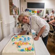 Pastor Shelly Davis cuts her retirement cake