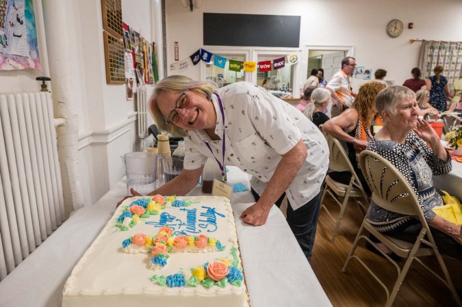 Pastor Shelly Davis cuts her retirement cake