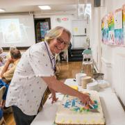 Pastor Shelly Davis cuts her retirement cake