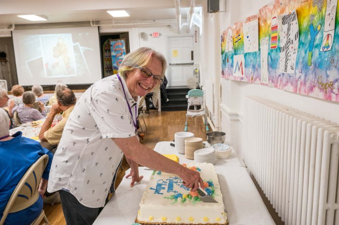 Pastor Shelly Davis cuts her retirement cake
