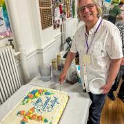 Pastor Shelly Davis cuts her retirement cake
