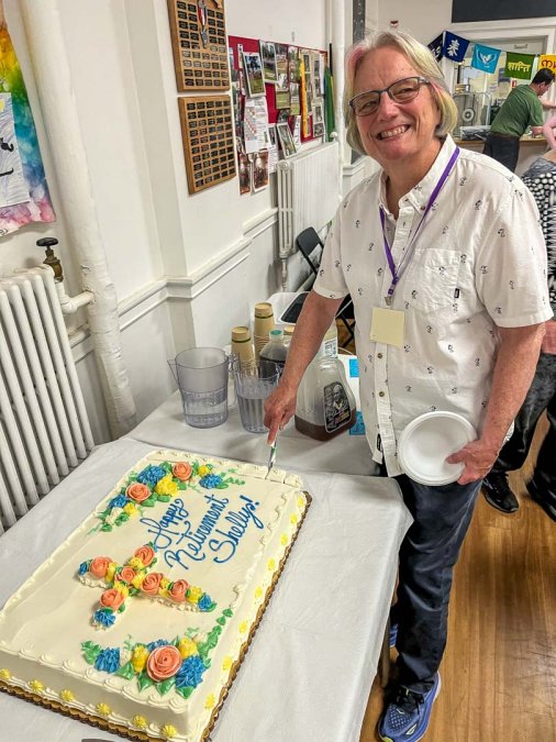 Pastor Shelly Davis cuts her retirement cake