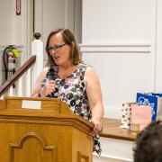 Margaret Carrols spoke of Shelly's support of and involvement with the Milton Coalition.