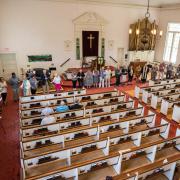 Congregants line the perimeter of the sanctuary for the closing hymn, "We Are Dancing Sarah's Circle"