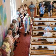 Congregants line the perimeter of the sanctuary for the closing hymn, "We Are Dancing Sarah's Circle"
