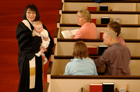 Rev. Arakawa introduces infant to congregation